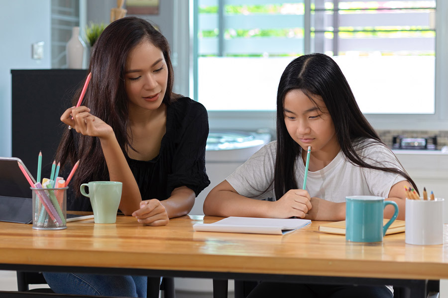 student and tutor together at a desk in San Fernando